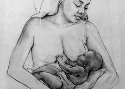 Woman breast feeding baby boy